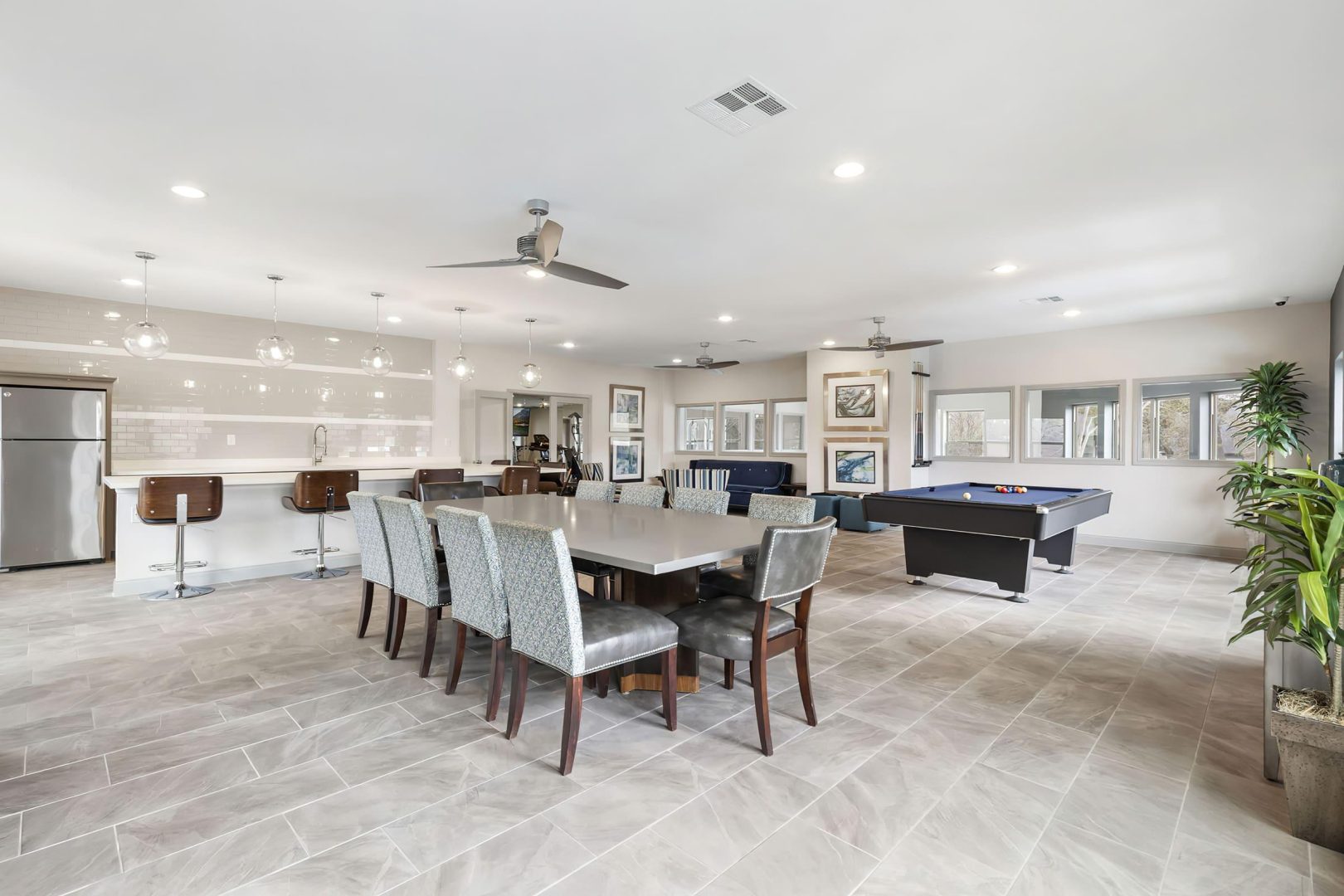 a large open concept living room with a pool table at The  Adelene